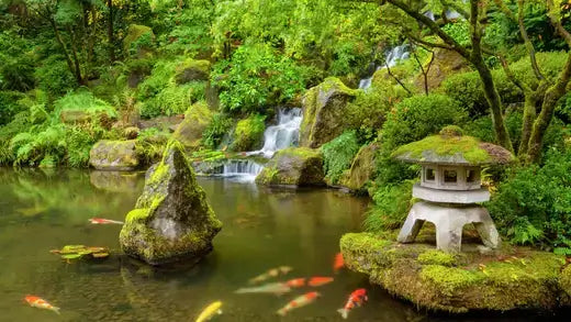 Moss-covered stone lantern with tiered roof on garden rock