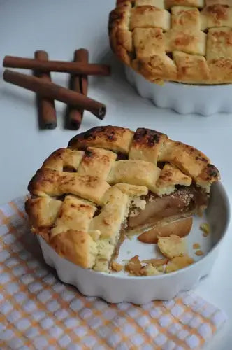 Golden-brown lattice-top apple pie, Americas favorite, slice removed
