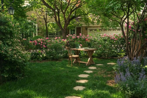 Wooden table and matching chair set in lush garden