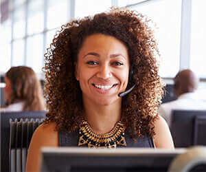 Smiling woman with curly brown hair in TN Nursery Forbes CSR feature