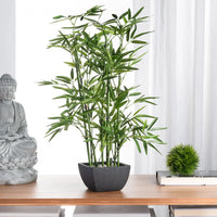 Tall lush green artificial bamboo plant in sleek black rectangular pot