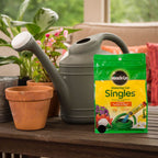 Green and yellow Miracle-Gro watering can singles plant food package
