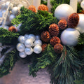 Glossy white ornaments with green pine branches and pinecones, 3 pack